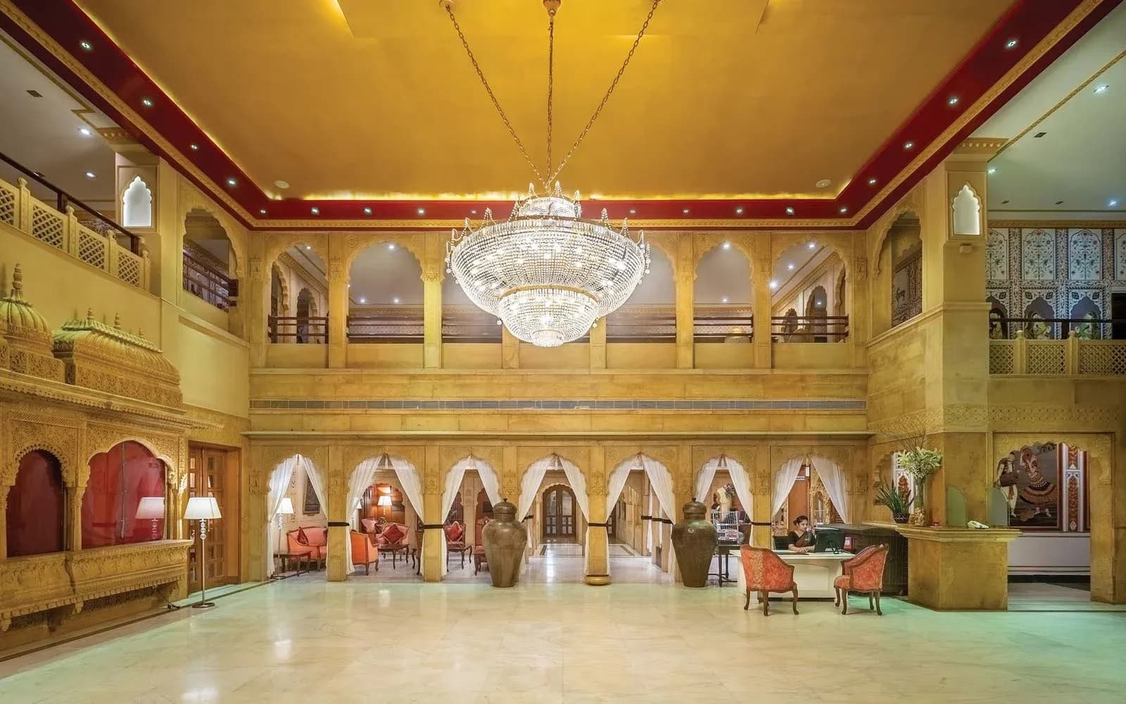Carved golden-sandstone jali and Thar architectural design detail at Hotel Rang Mahal