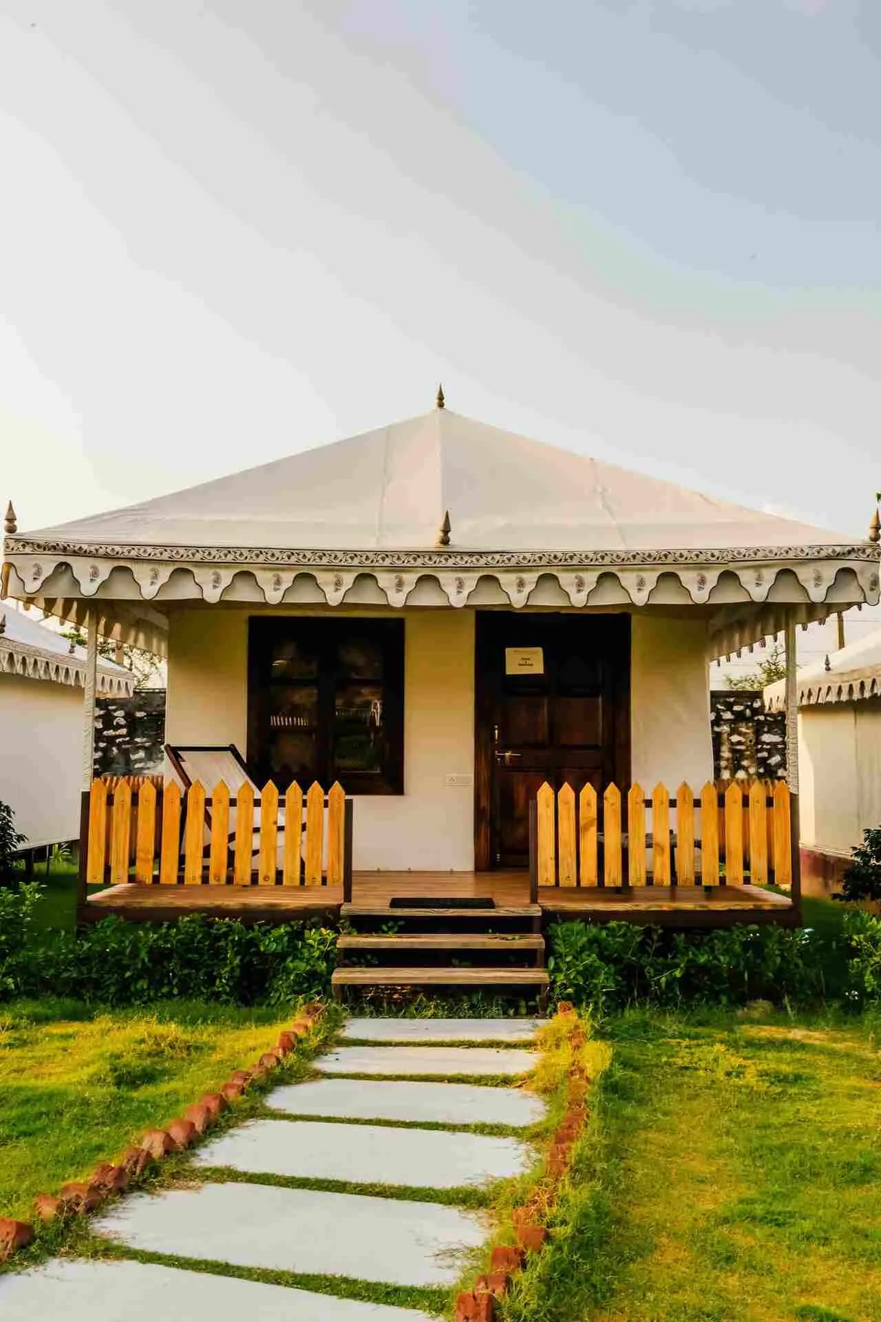 Luxury tent canvas, wooden furnishing and lantern decor detail at Rawai Luxury Tents Pushkar