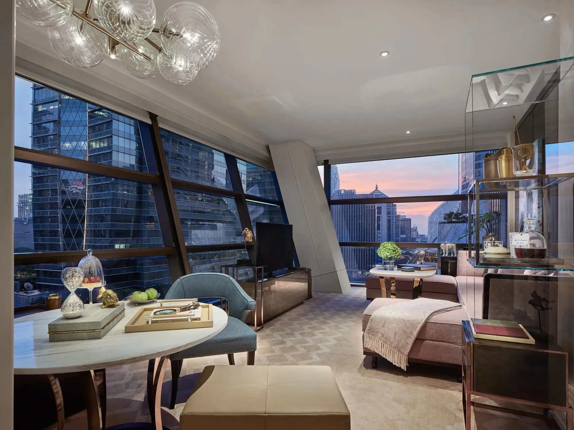 Manor Suite living room with contemporary design and city views at Rosewood Bangkok