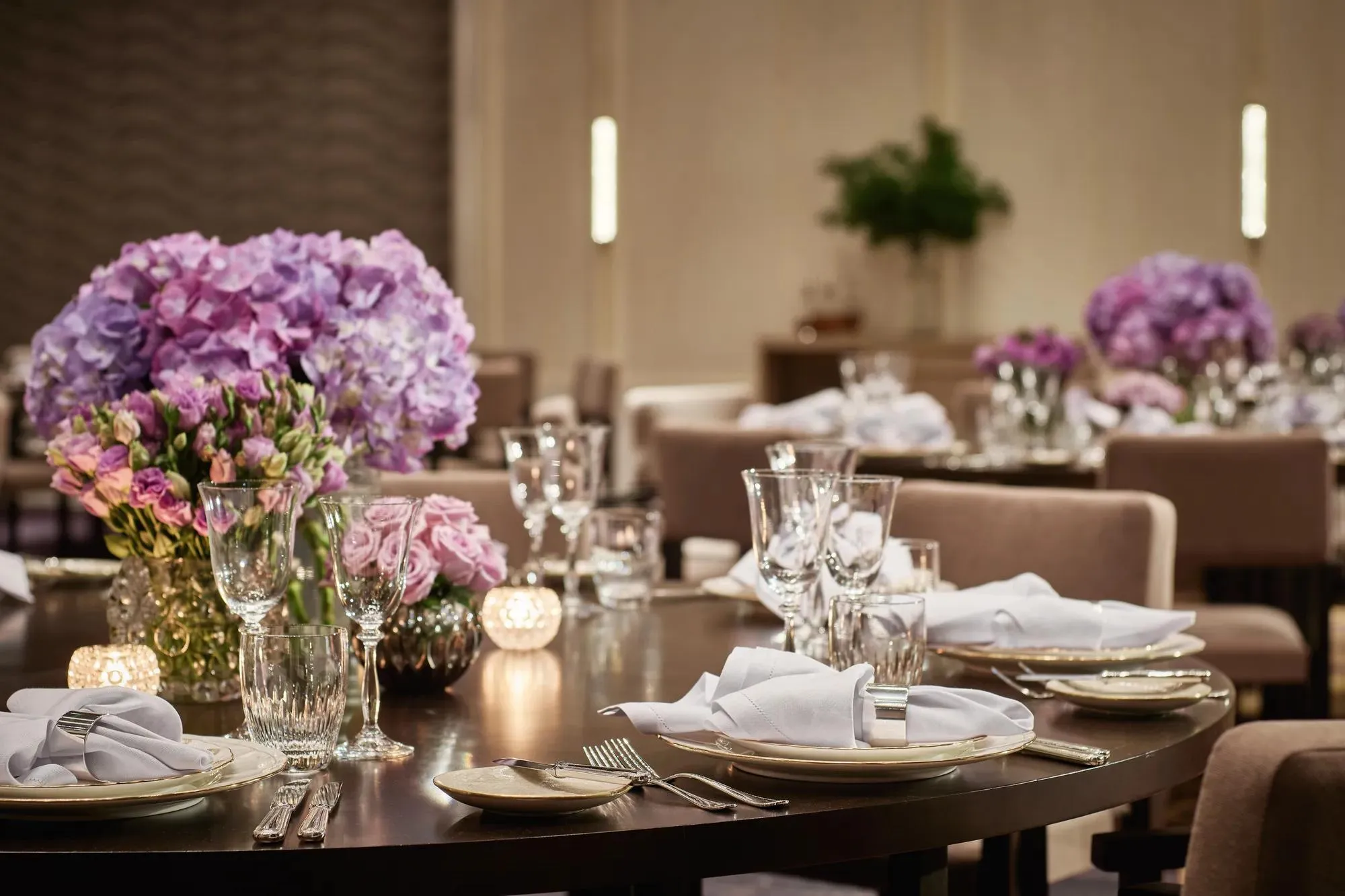 Pavilion Ballroom set with round tables for a sit-down dinner at Rosewood Bangkok