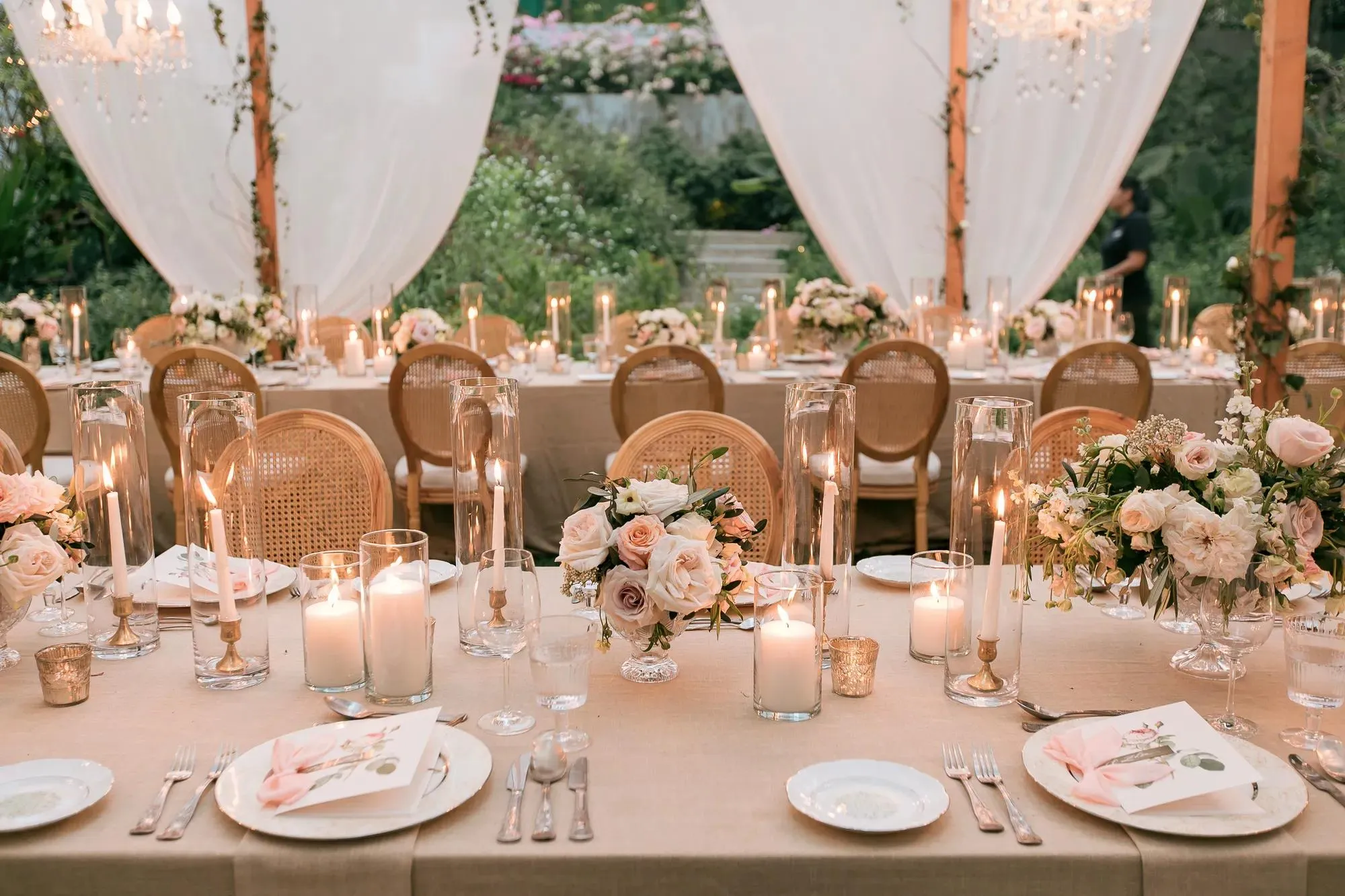 Outdoor wedding reception with draped decor and chandeliers at Rosewood Phuket, Phuket Thailand