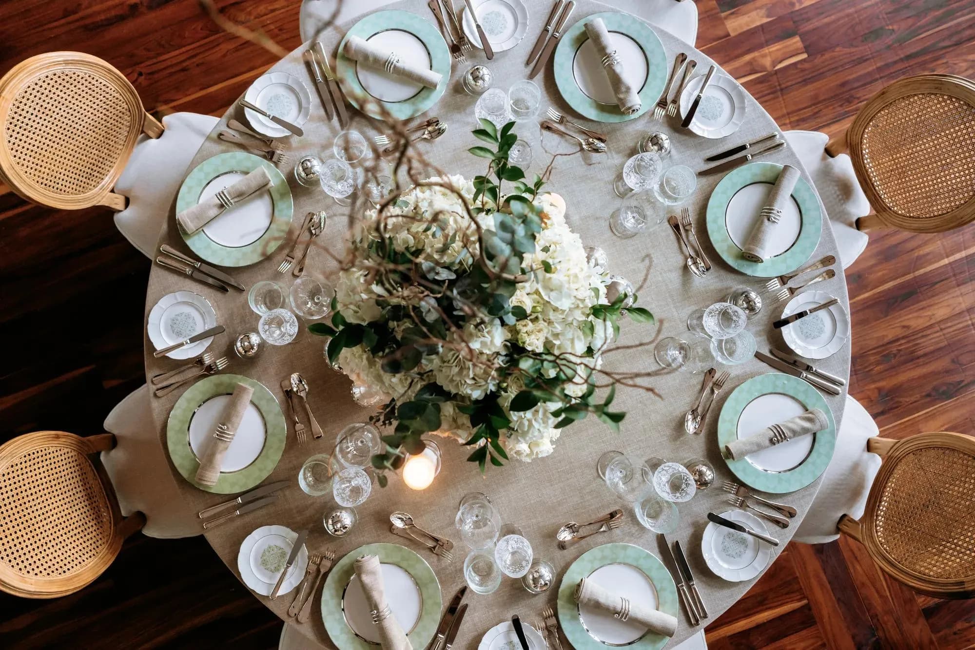 Wedding reception table setting with florals and fine detail at Rosewood Phuket, Thailand