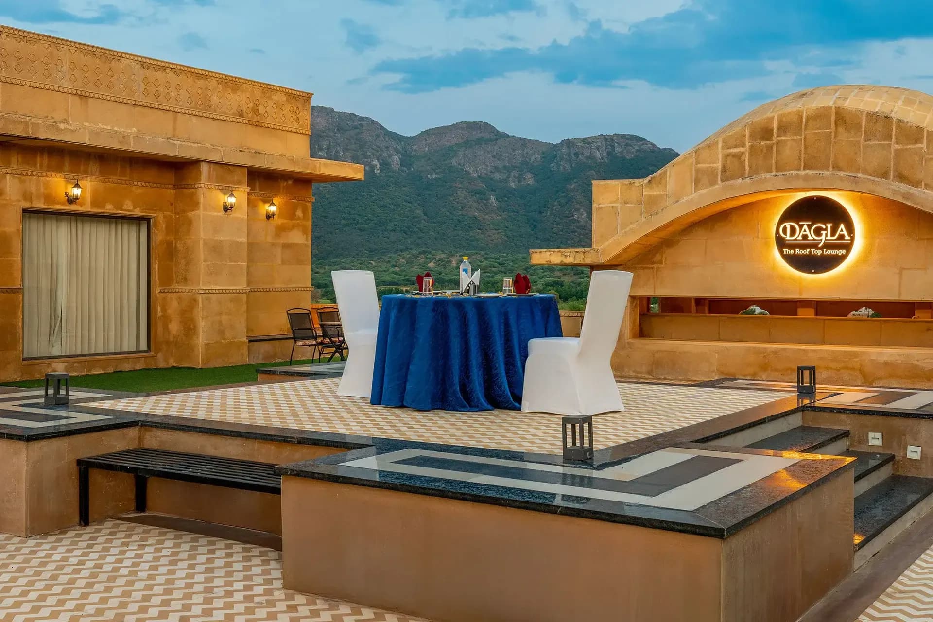 Evening sundowner sangeet celebration on the pool deck at Sahdev Bagh Pushkar