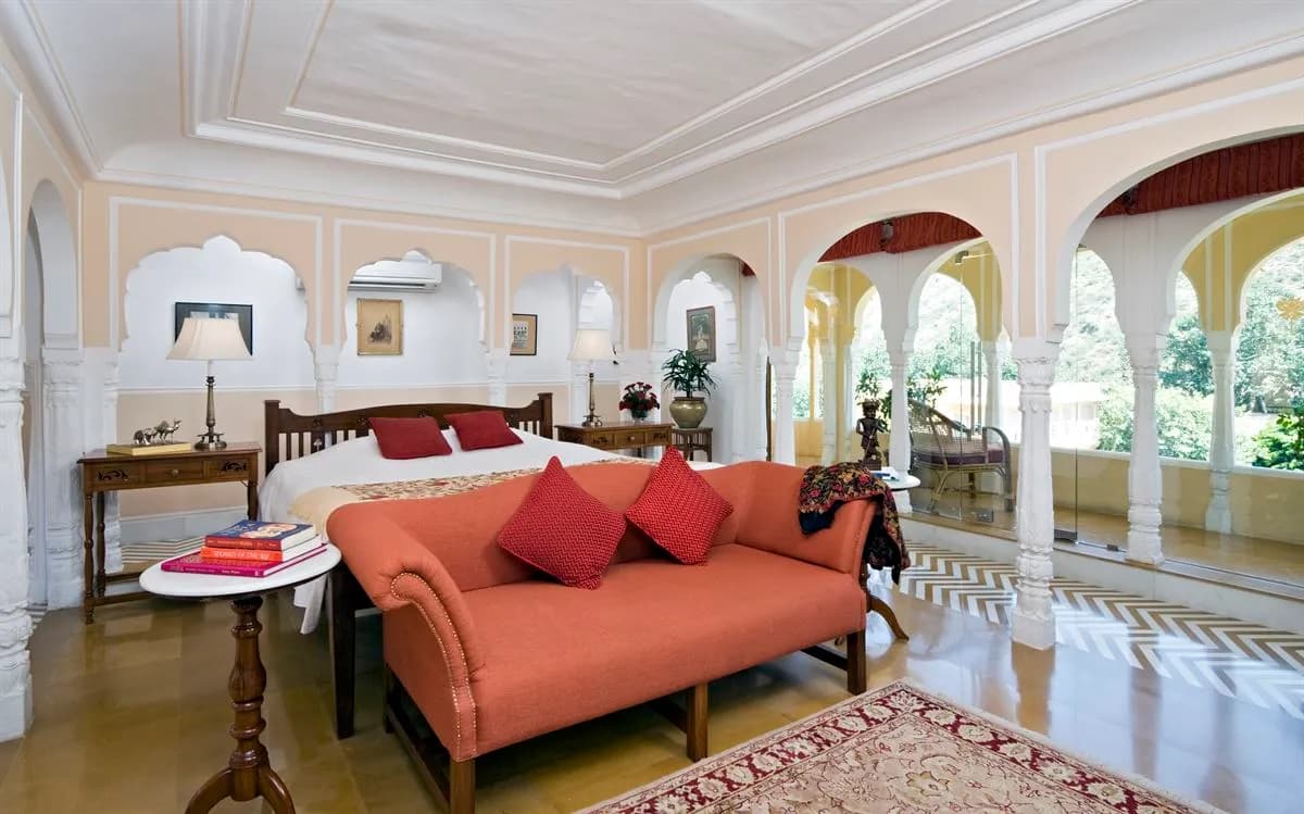 Mughal arched doorways and vibrant hand-painted mural detail at Samode Palace Jaipur