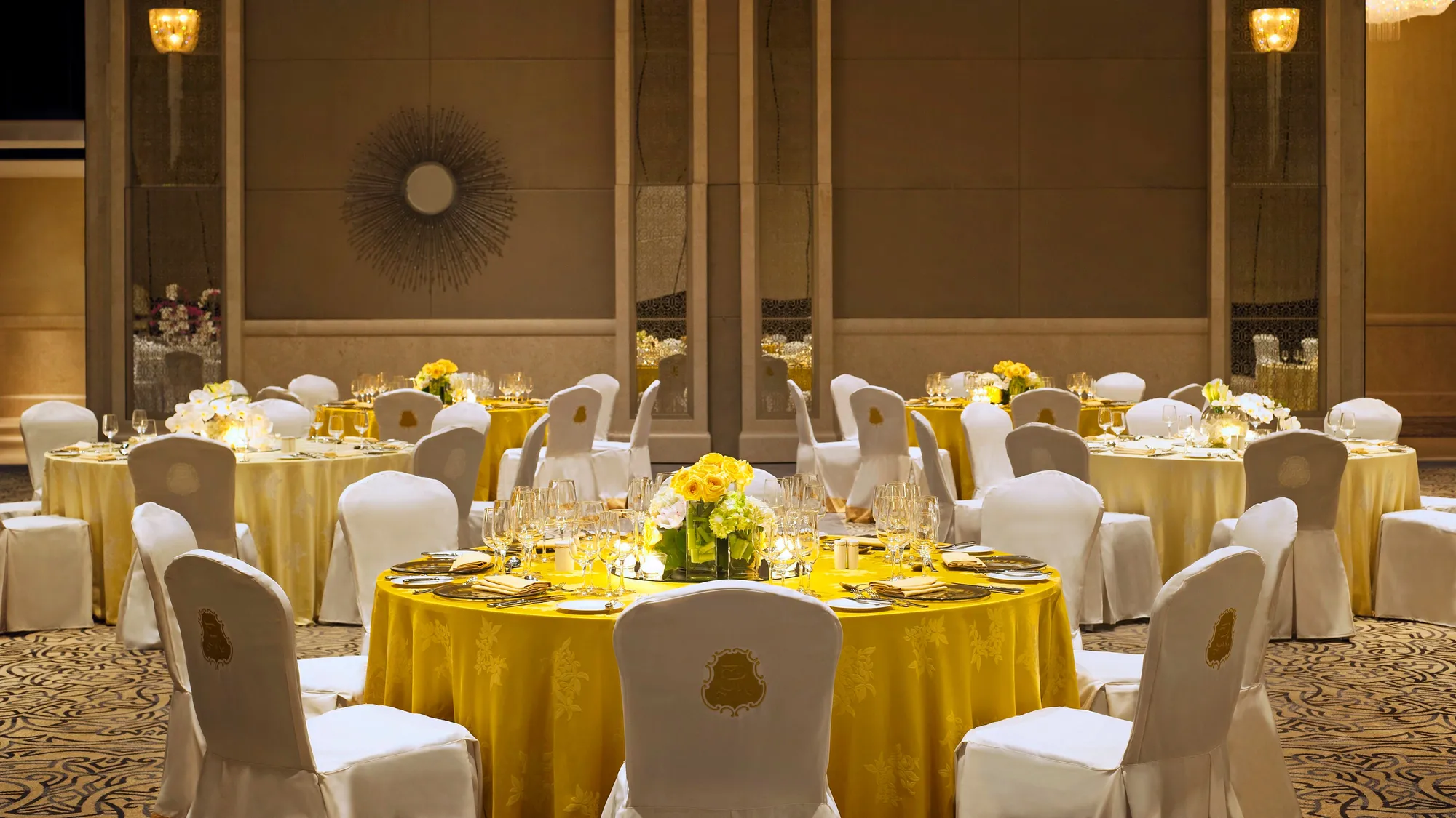 Regal Ballroom set with crystal chandeliers for a grand wedding reception at The St. Regis Saadiyat Island Resort, Abu Dhabi