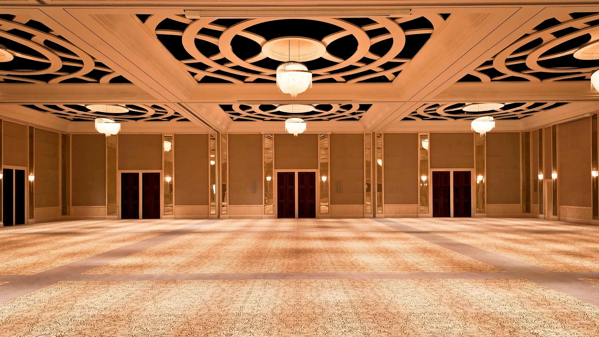 Regal Ballroom dressed for a wedding reception with chandeliers at The St. Regis Saadiyat Island Resort, Abu Dhabi
