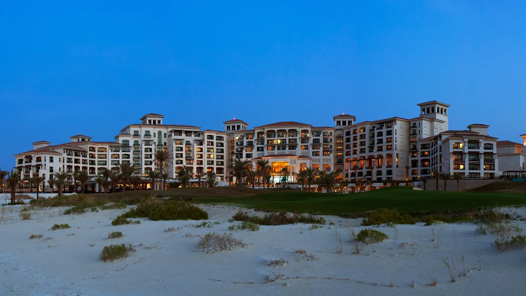 The St. Regis Saadiyat Island Resort illuminated against the Arabian Gulf at night, Abu Dhabi