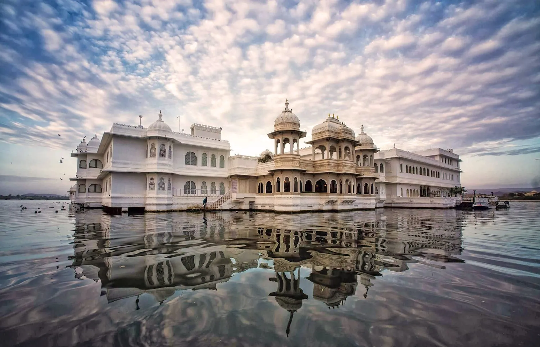 Aerial view of Taj Lake Palace white-marble palace floating on Lake Pichola in Udaipur