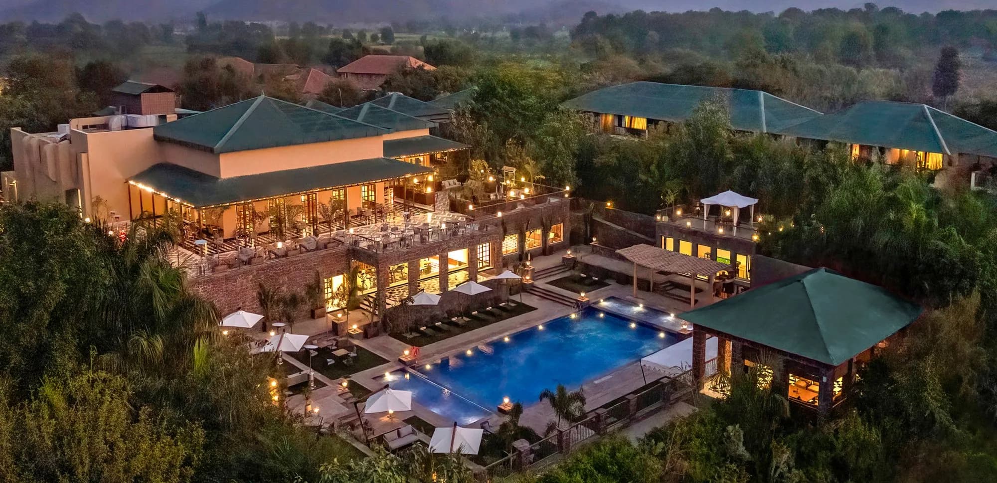 Taj Sawai Ranthambore colonial-style resort facade with lily ponds and gardens on the edge of Ranthambore National Park