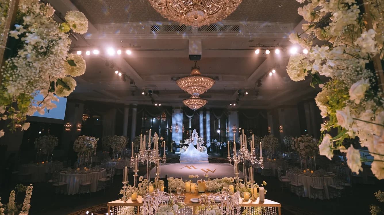 Grand wedding reception ballroom setup with stage and seating at The Athenee Hotel Bangkok