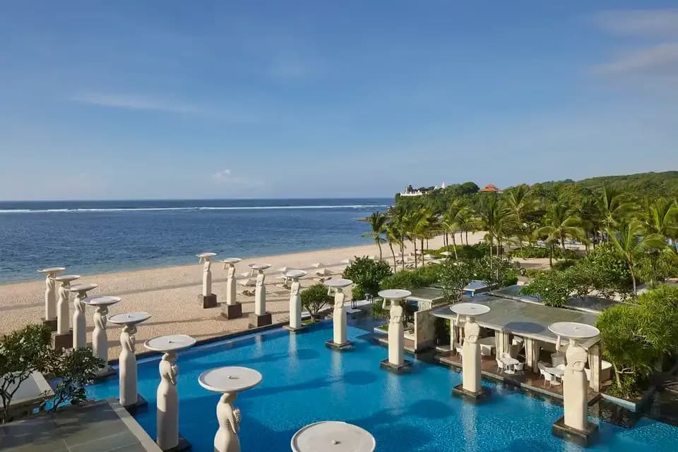 Oasis infinity pool reaching toward the Indian Ocean at The Mulia Bali, Nusa Dua