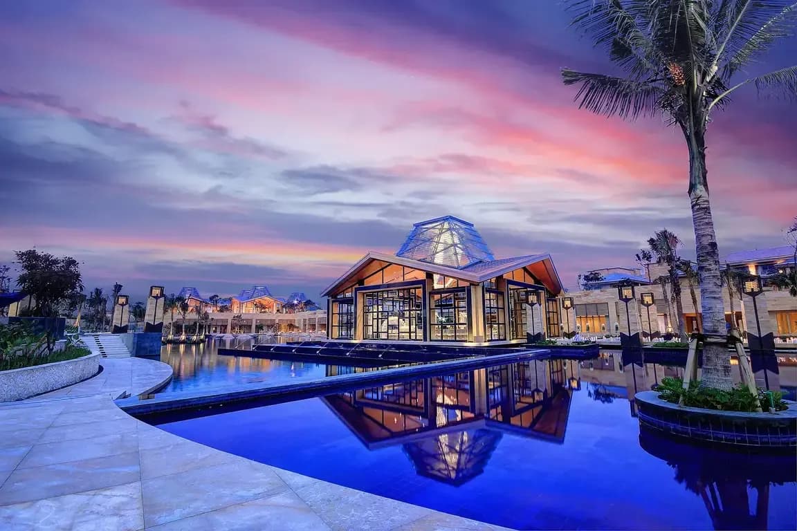 Eternity floating glass wedding chapel over Mulia Lake with a crystal chandelier at The Mulia Bali