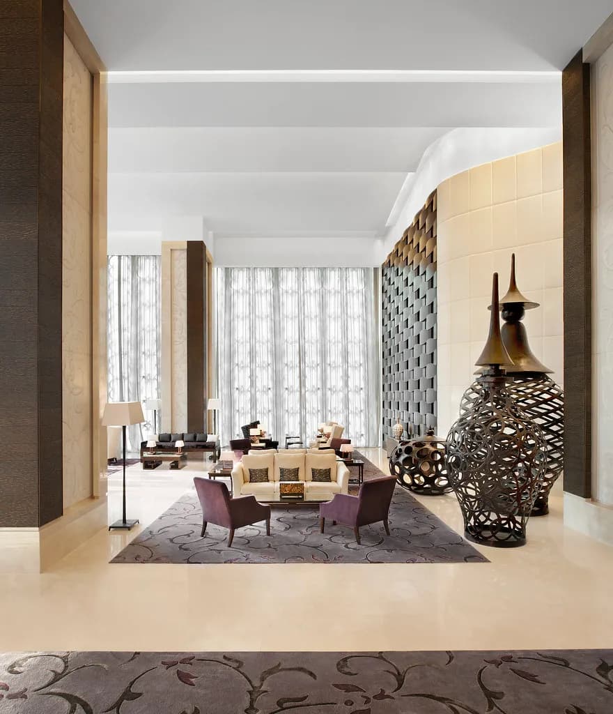 Elegant lounge interior at The St. Regis Bangkok with residential-style furnishings