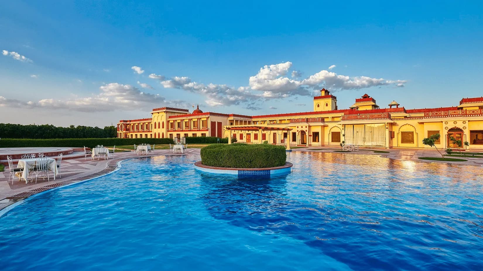 Poolside lawn and central sandstone courtyard at The Ummed Jodhpur