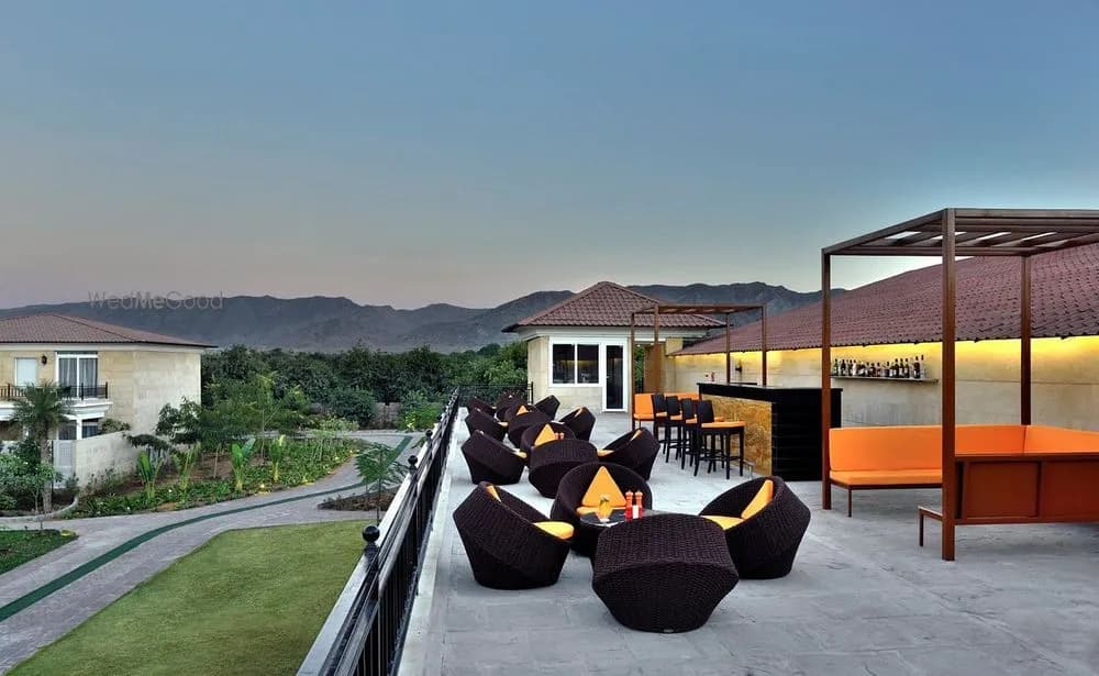 Panorama rooftop lounge and bar with seating and Aravalli hill views at dusk, The Westin Pushkar Resort & Spa