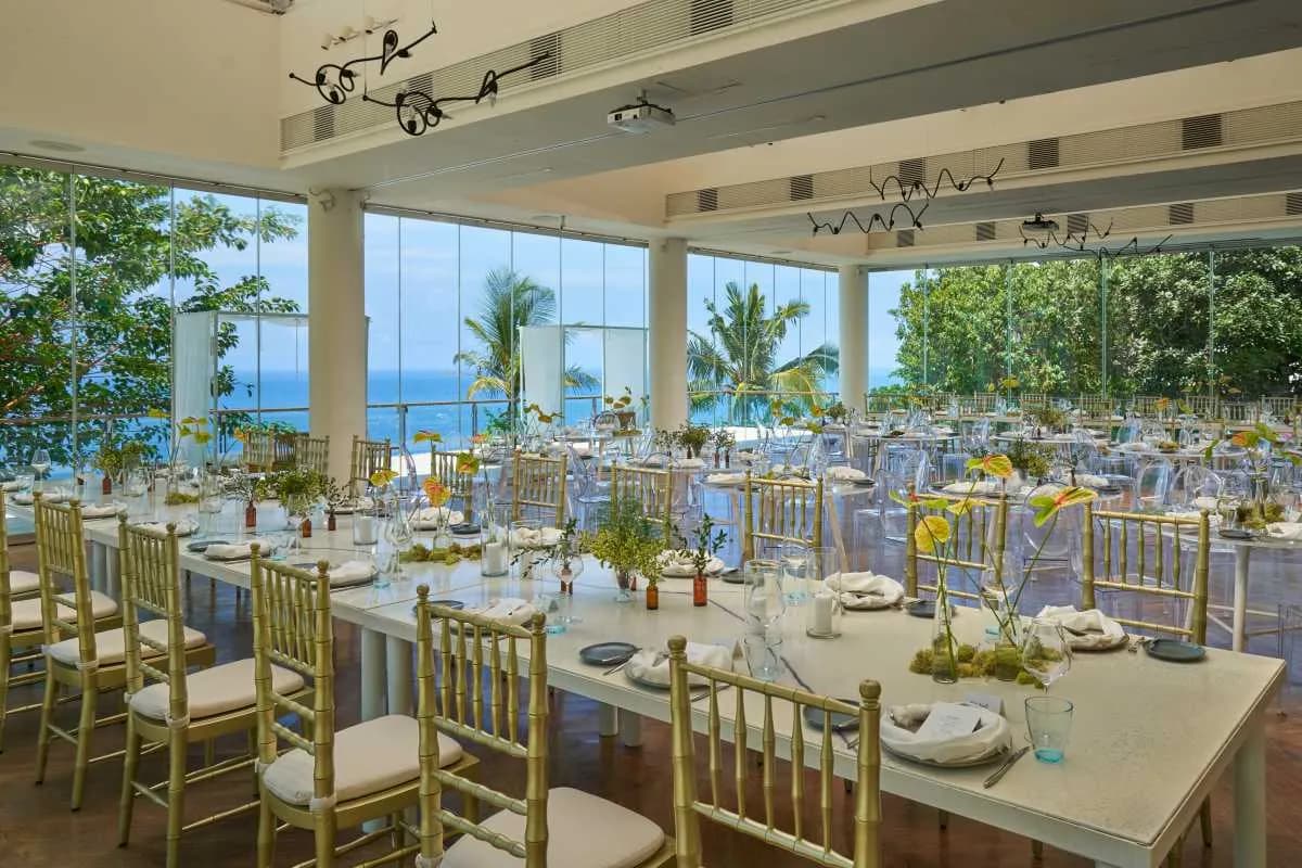Glass Stage clifftop wedding reception and dinner setting at Tirtha Uluwatu, Bali