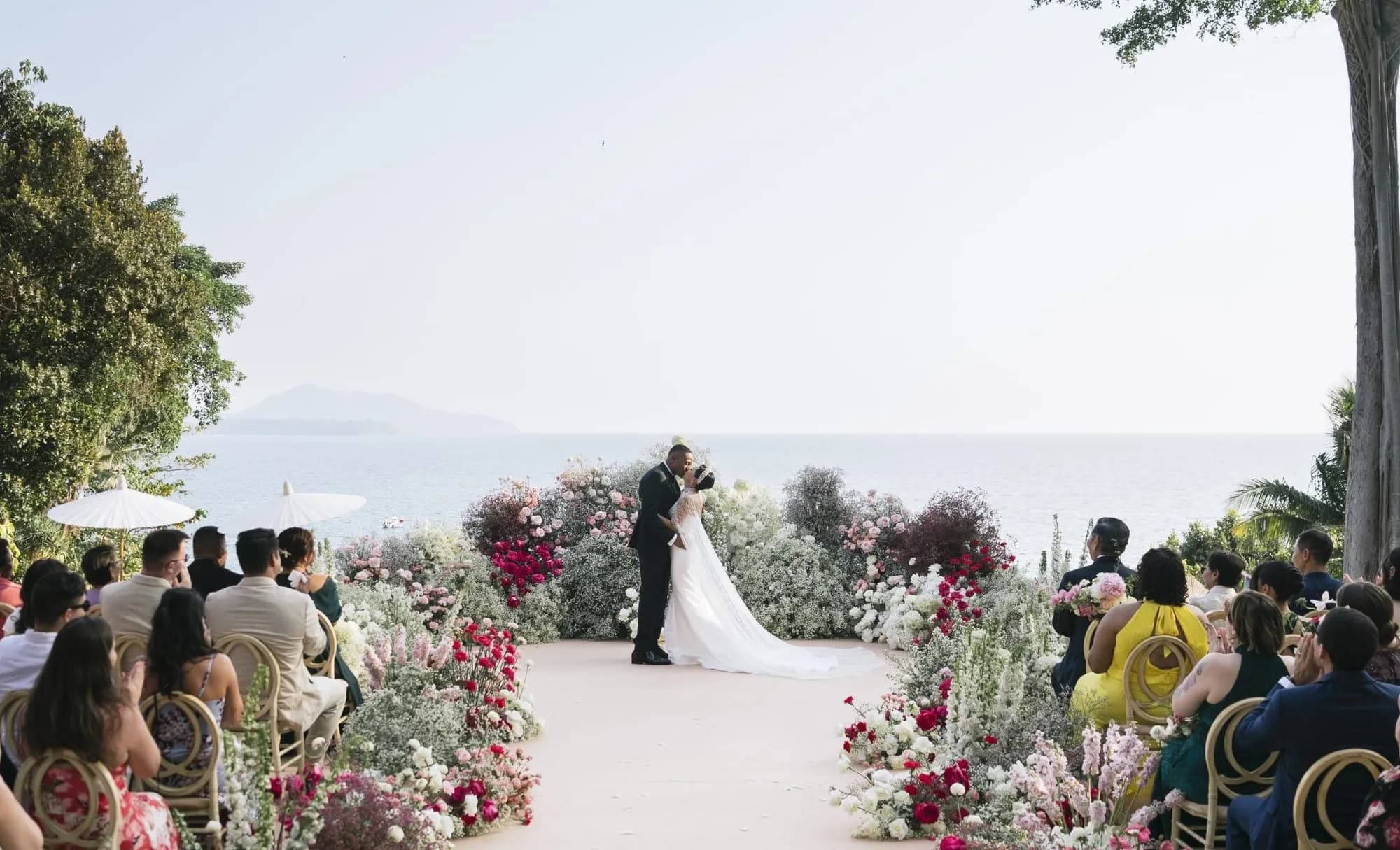 Trisara Phuket oceanfront teak deck wedding ceremony at sunset above the Andaman Sea on the northwest coast