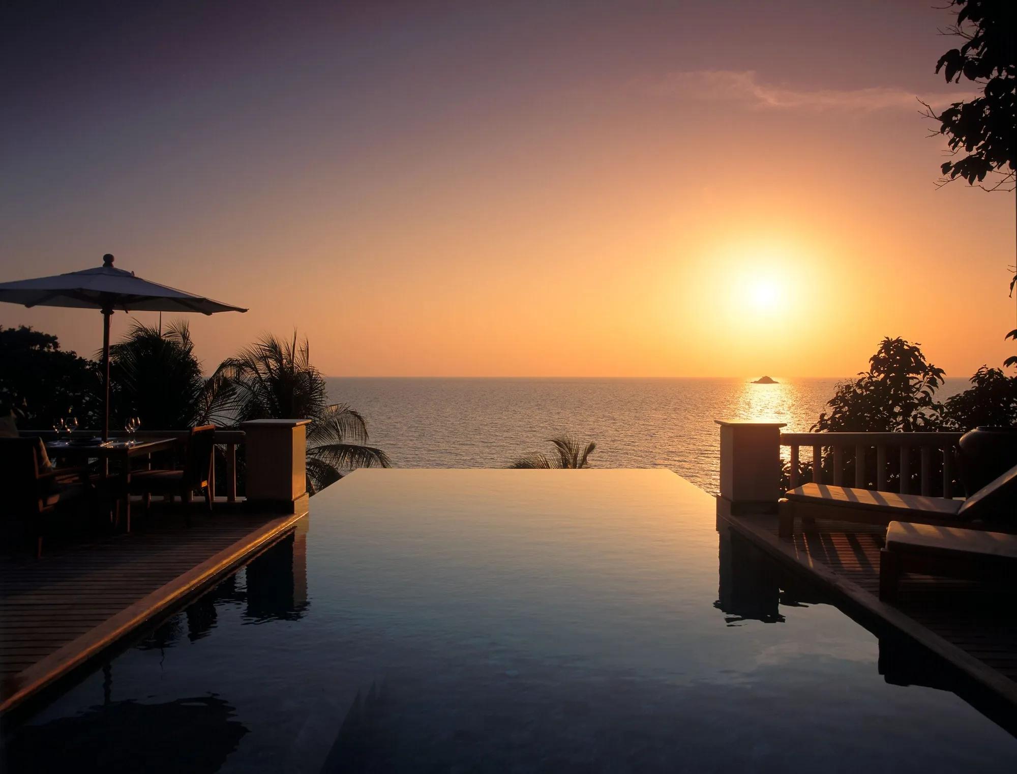 Trisara Phuket ocean-front pool villa with infinity pool above the Andaman Sea at sunset