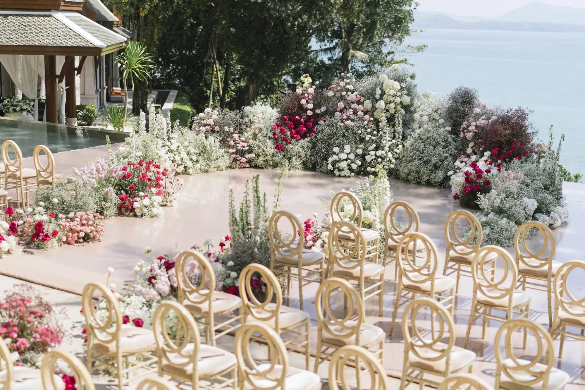 Trisara Phuket garden lawn and ancient ficus grove ceremony setting above the Andaman bay