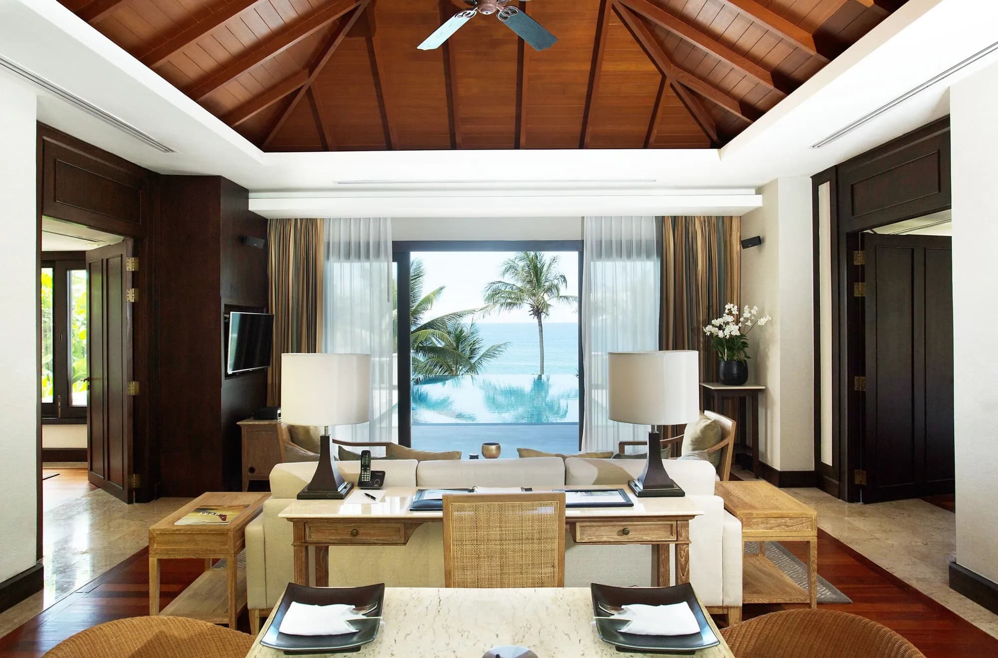 Trisara Phuket villa estate and the Andaman Sea coastline at golden-hour sunset