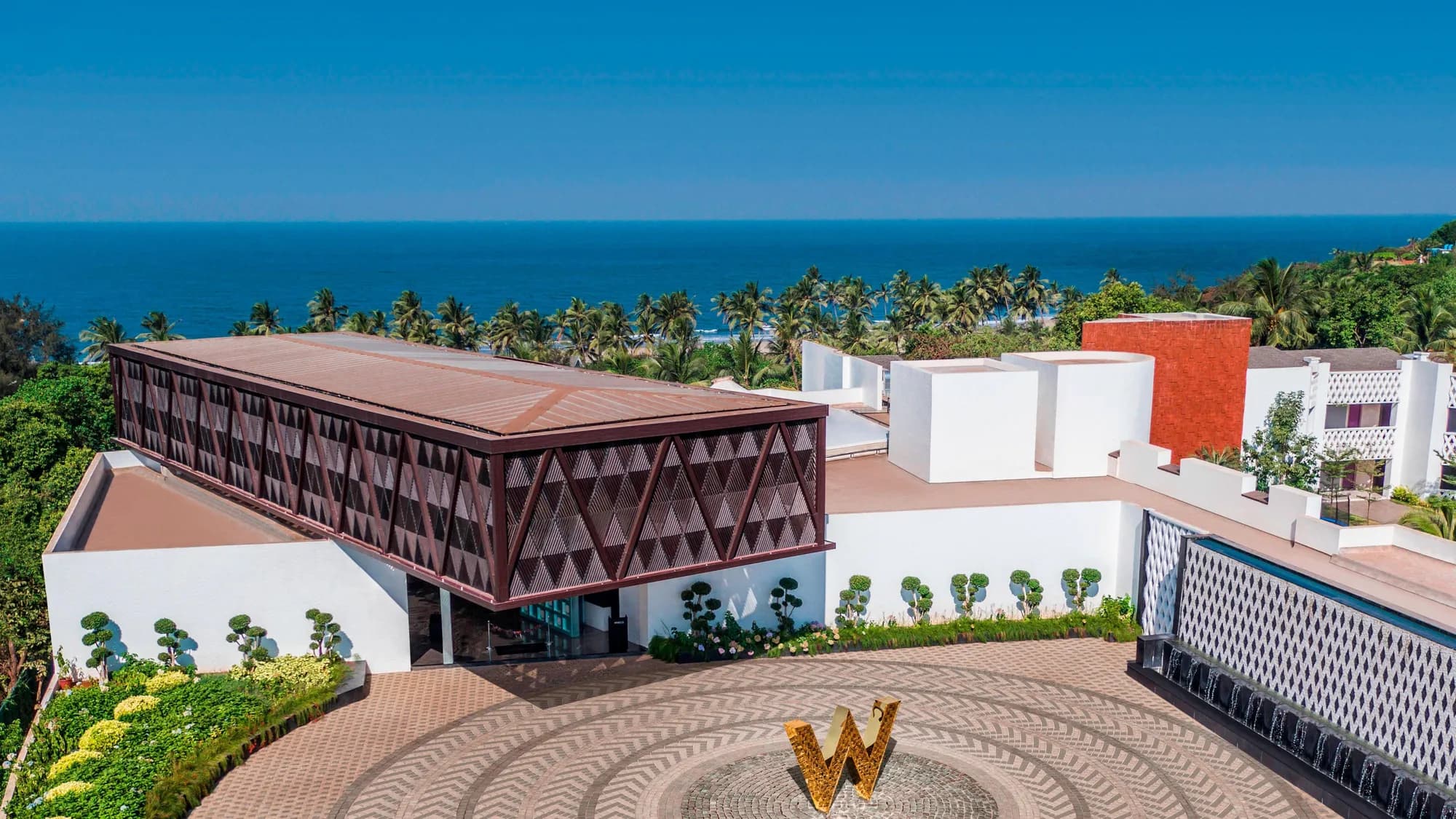 Aerial view of W Goa cliffside resort above Vagator beach, North Goa
