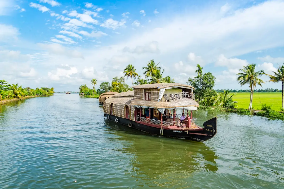 Kerala backwaters with traditional houseboat at sunset