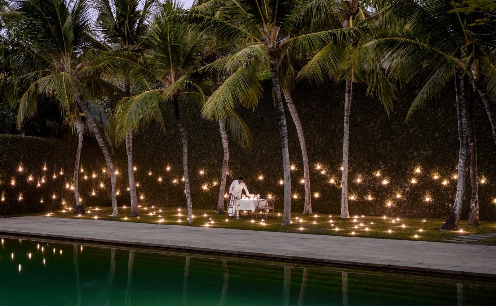 Candle-lit outdoor private dining setup at Amangalla Galle Fort in the evening