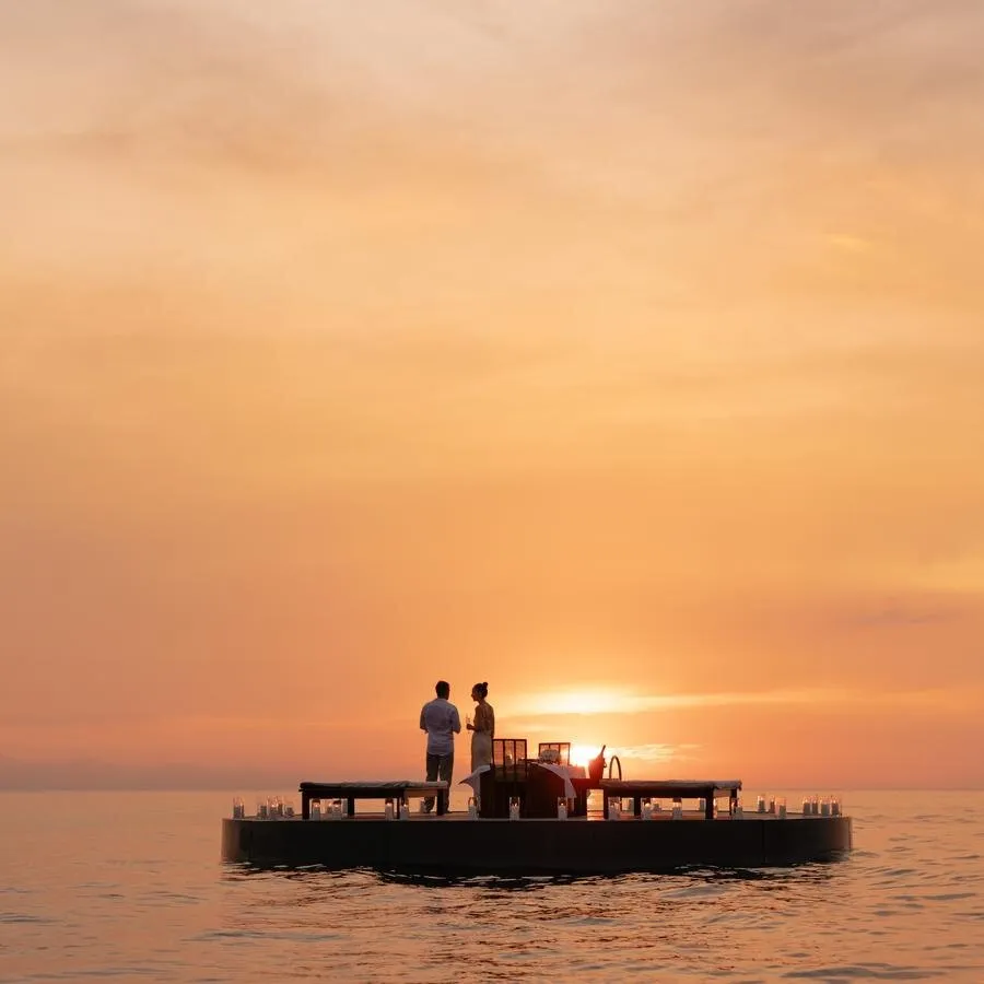 Sunset over the Andaman Sea and Pansea Beach off the Amanpuri headland, Phuket, Thailand