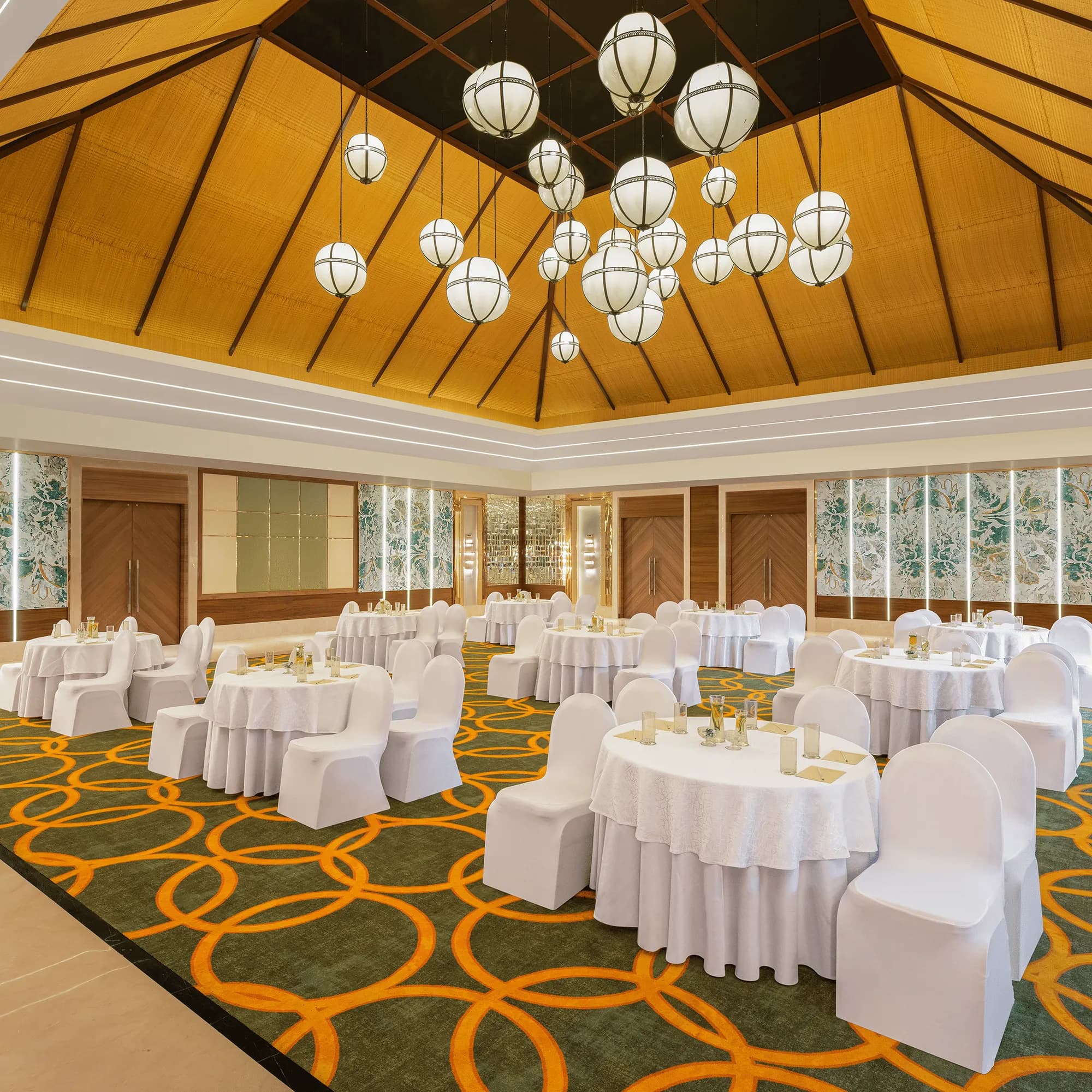 Pillarless air-conditioned Aravali Banquet Hall set for a wedding dinner at Ananta Spa & Resort Pushkar