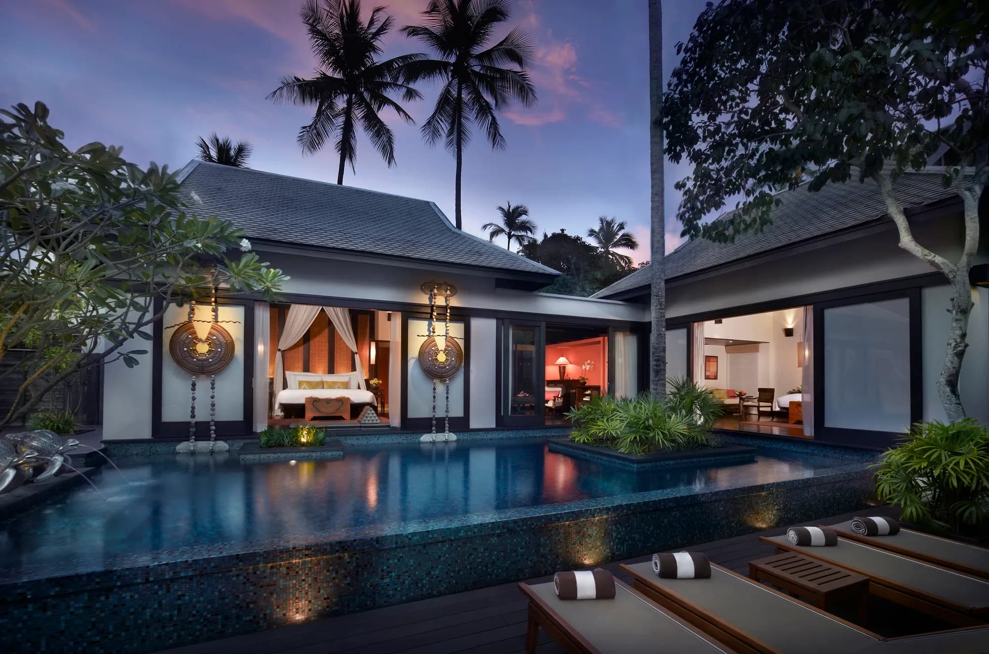 Sala pool villa exterior beside the tropical lagoon at Anantara Mai Khao Phuket Villas, Thailand
