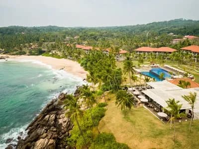 Coconut estate grounds and clifftop arrival approach at Anantara Peace Haven Tangalle Resort, Sri Lanka