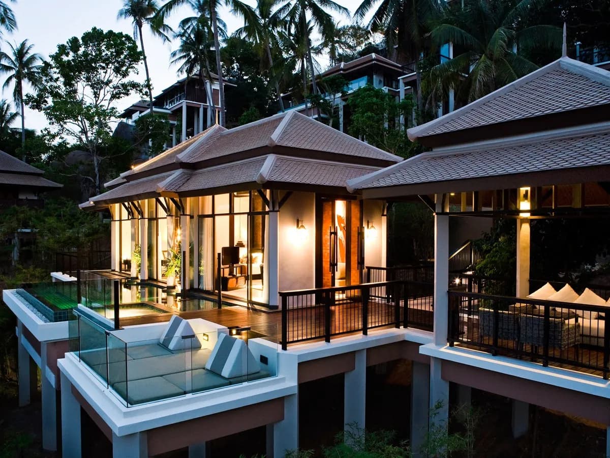 Banyan Tree Samui Thai-roofed pool villas with private infinity pools terraced down the jungled hillside above Lamai Bay, Koh Samui