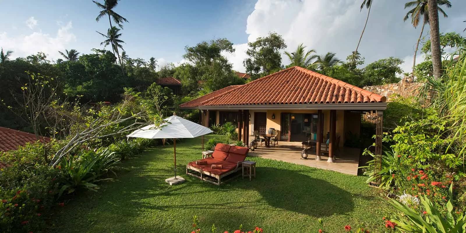 Lush tropical gardens and pathways across the headland at Cape Weligama, Sri Lanka