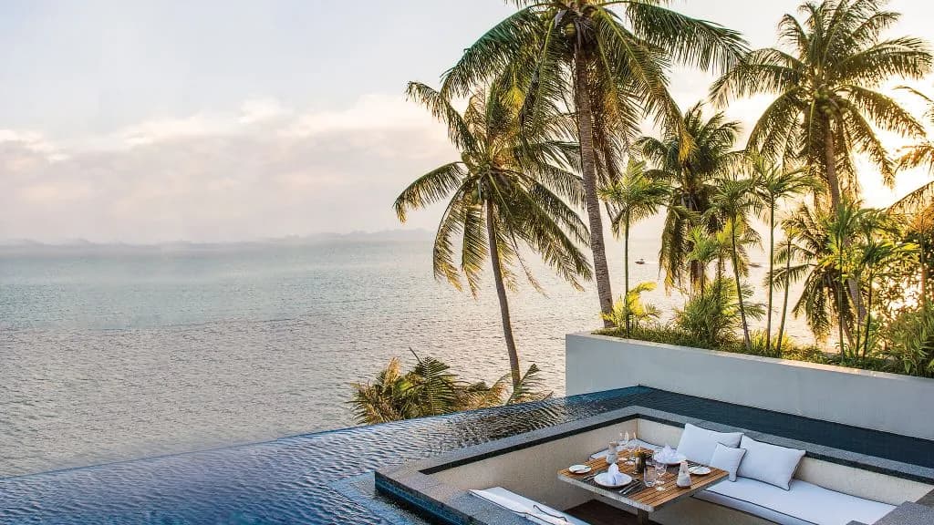 Conrad Royal Oceanview pool villa deck set for private poolside dining at Conrad Koh Samui