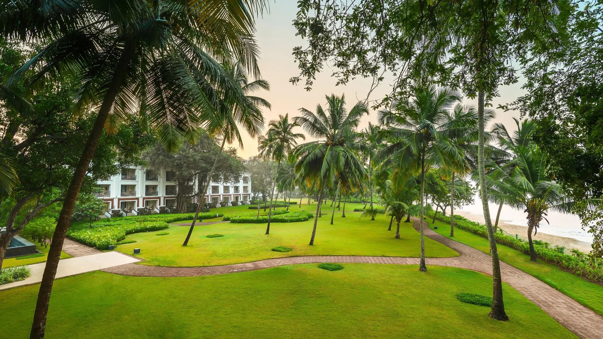 Landscaped lawns overlooking Bambolim Bay at Grand Hyatt Goa