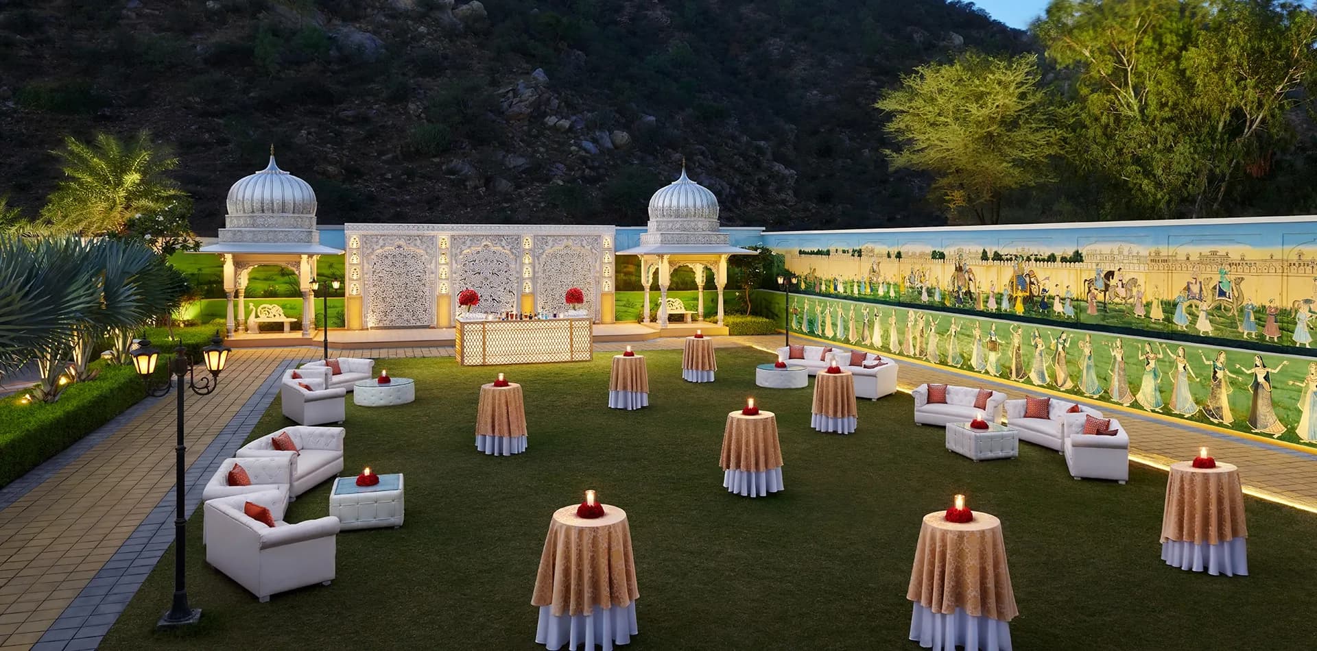 Sundarban Lawns outdoor wedding space framed by the Aravalli foothills at The Leela Palace Jaipur