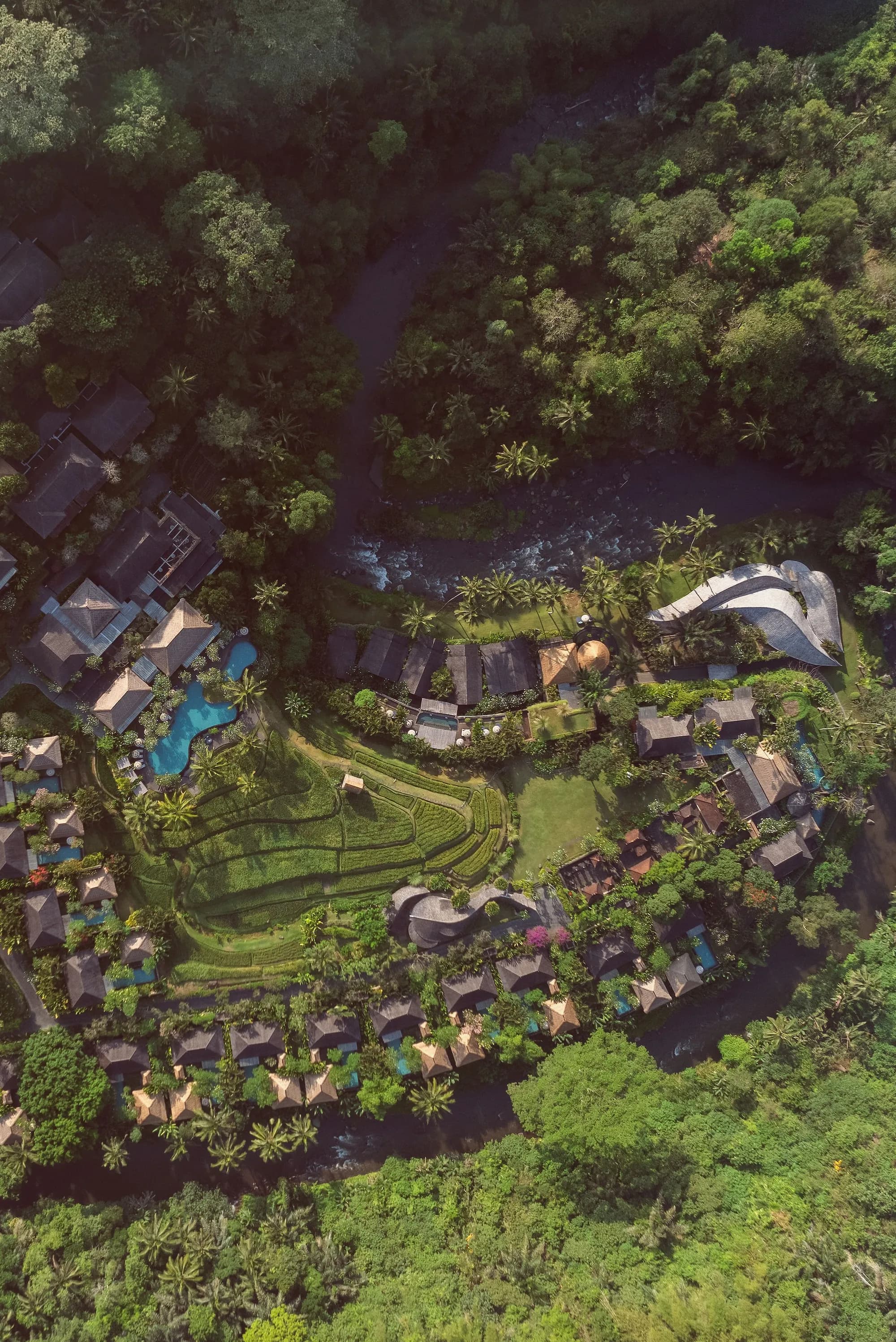Aerial exterior of Mandapa a Ritz-Carlton Reserve in the green Ayung River valley with rainforest near Ubud Bali