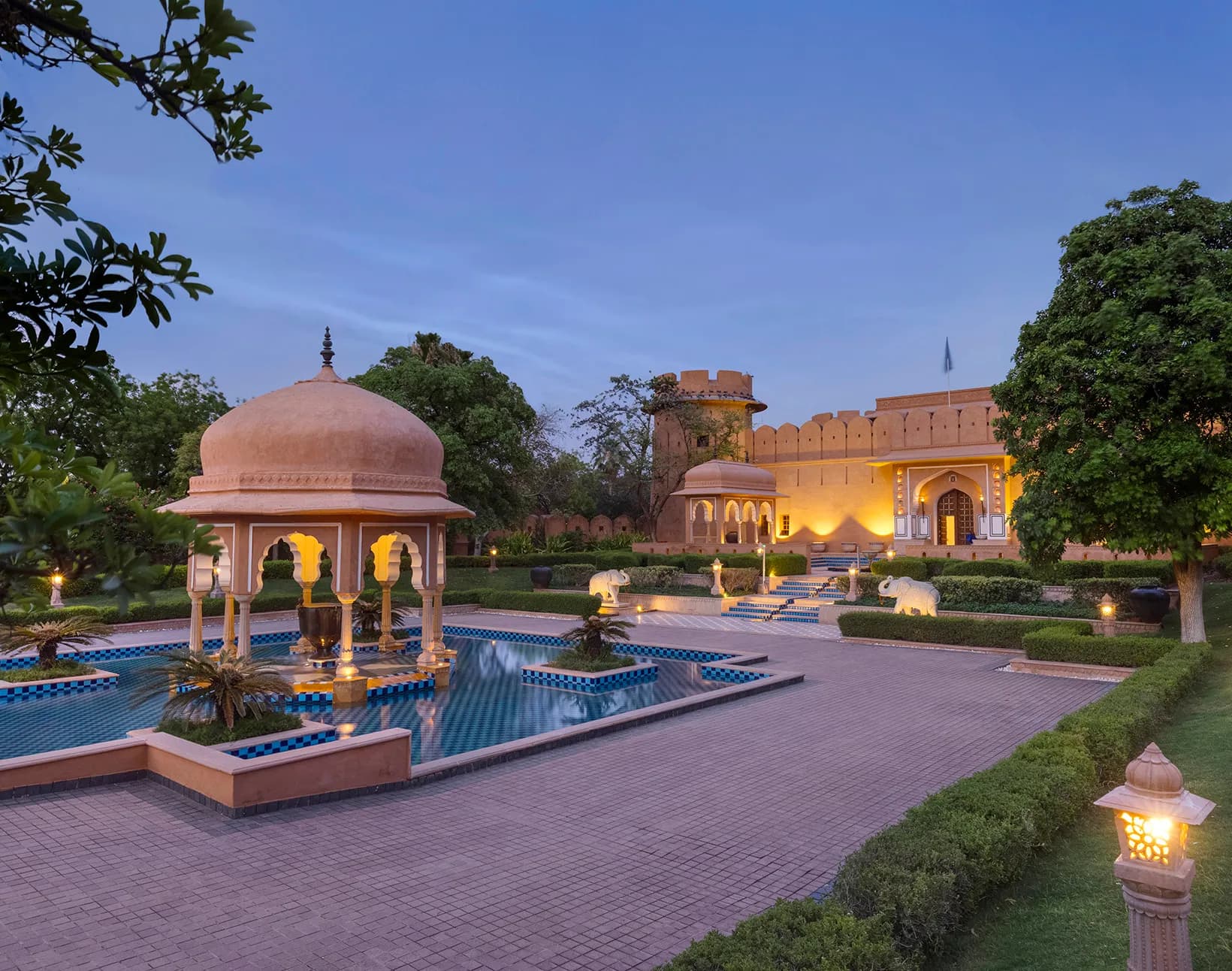 Aerial-style view of The Oberoi Rajvilas Jaipur fort-style architecture and landscaped gardens