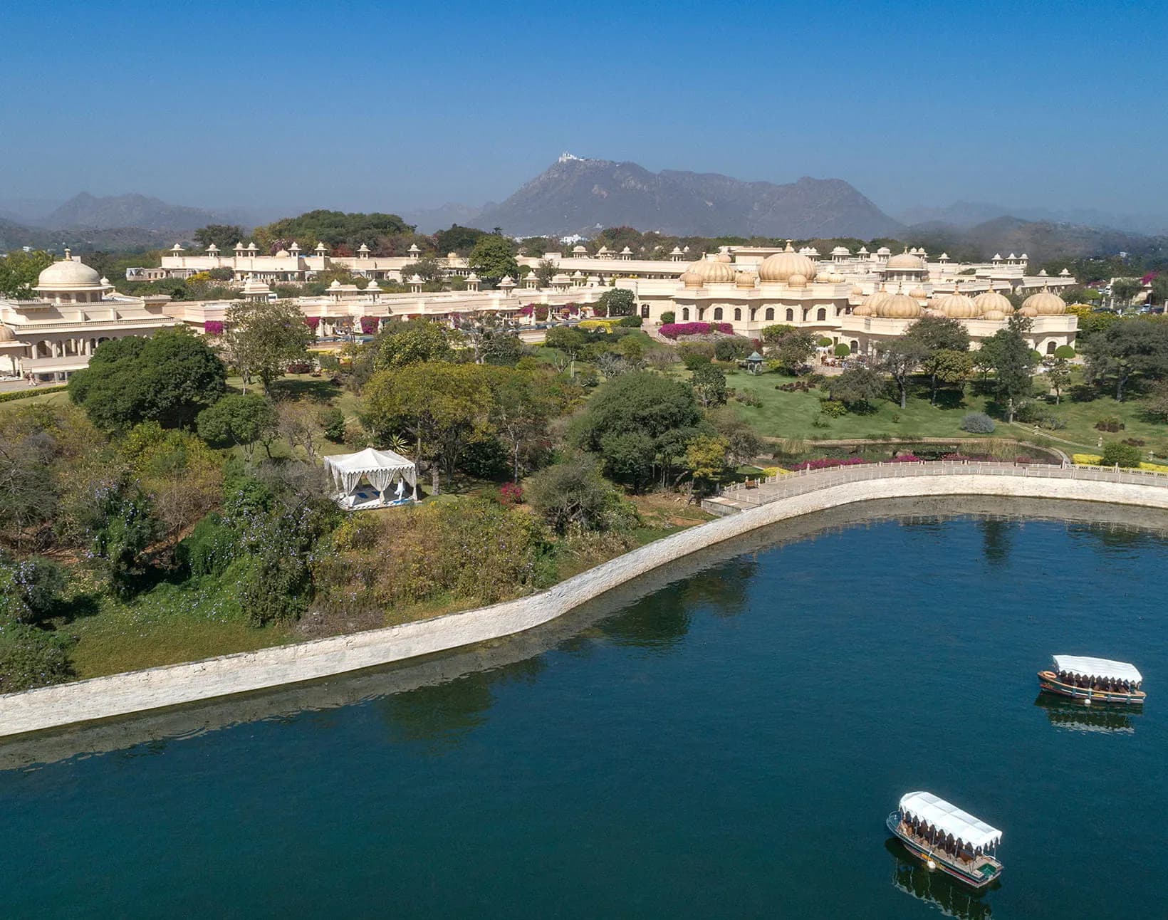 Lakefront arrival forecourt and reflecting pool at The Oberoi Udaivilas Udaipur