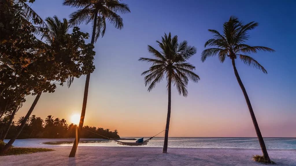 Hammock at a One&Only Reethi Rah beach villa overlooking the turquoise lagoon, Maldives