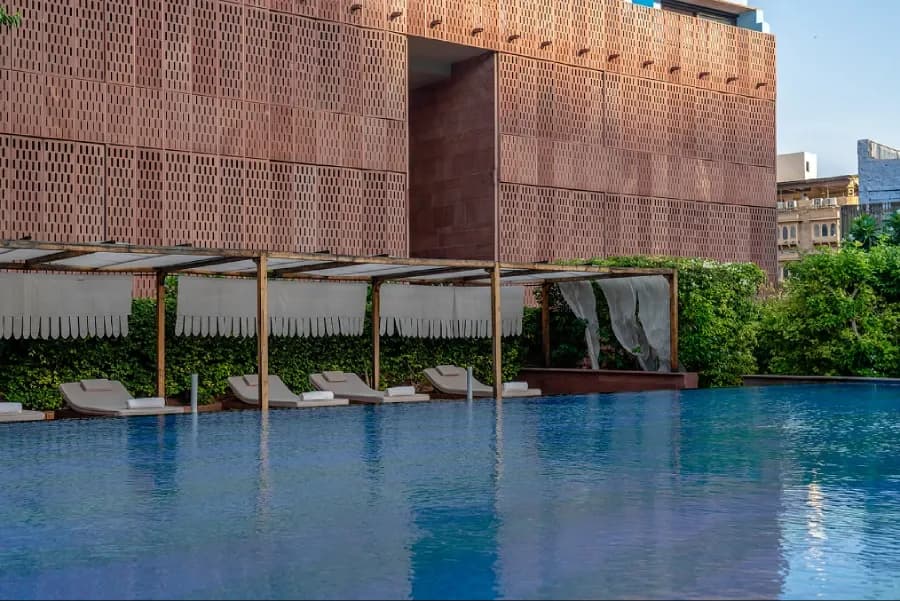 Luxury room with stone-carved detail and direct Mehrangarh Fort view at RAAS Jodhpur