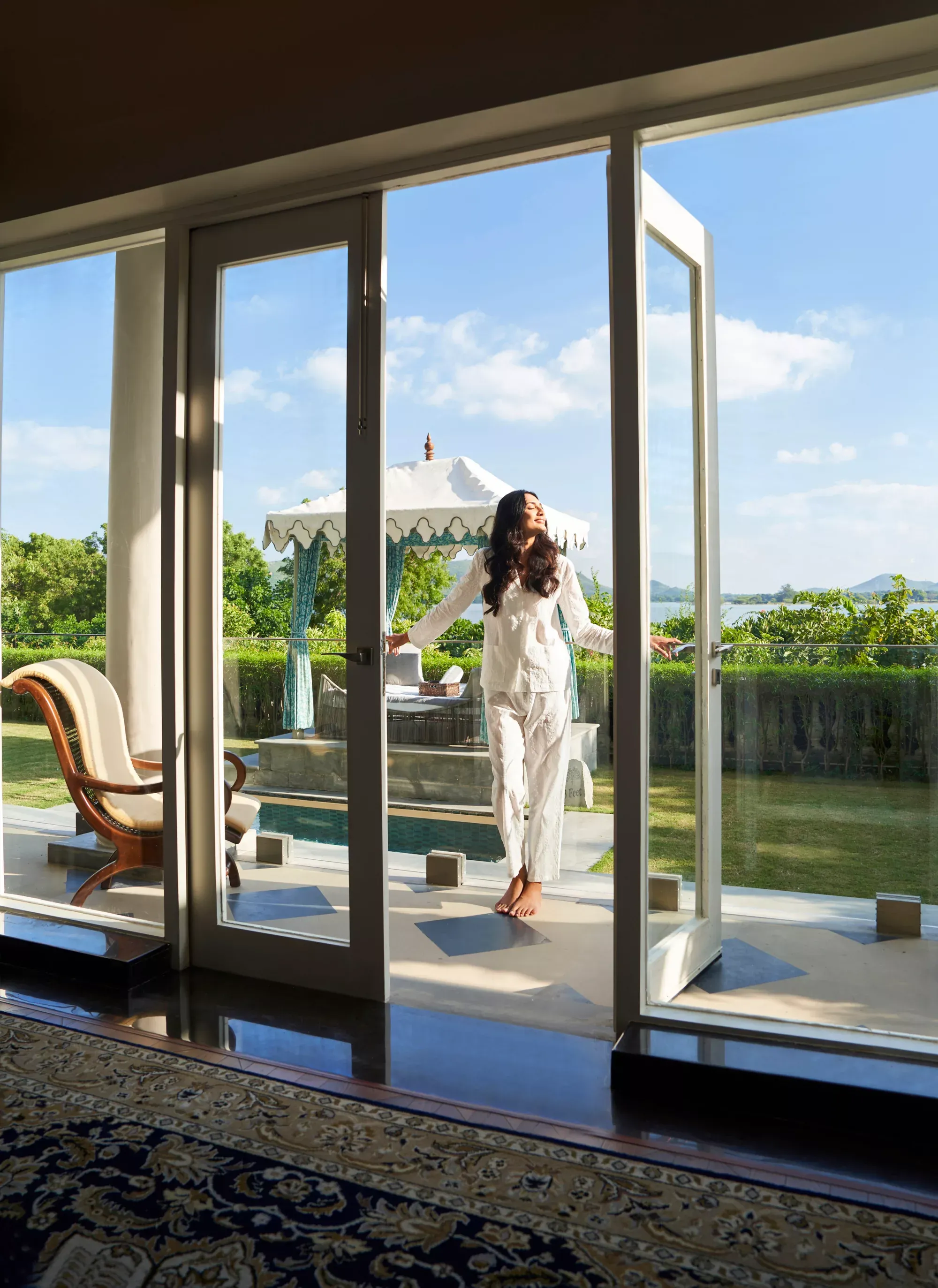 Luxury suite with lake views and handcrafted furnishings at Raffles Udaipur