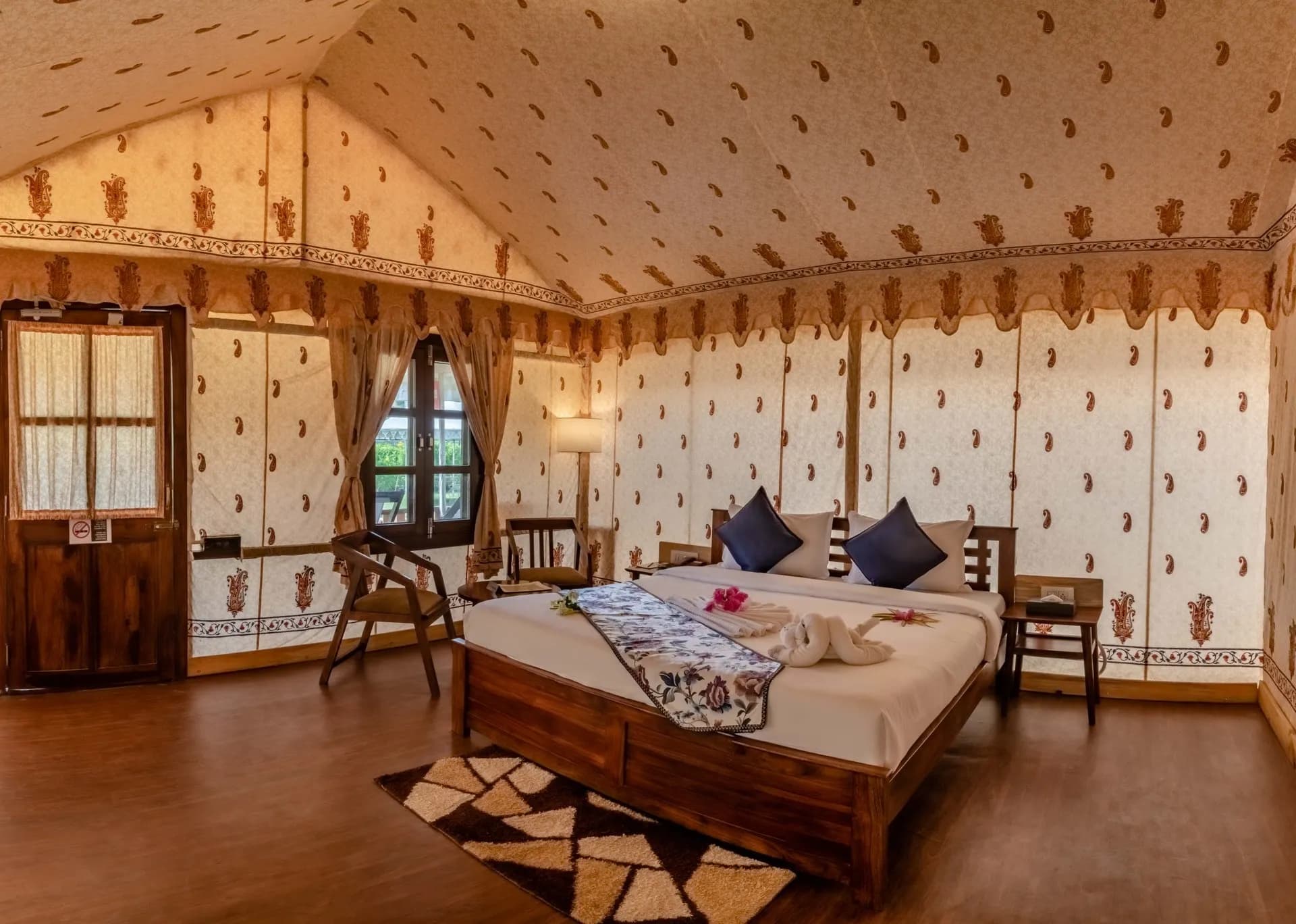Exterior of Rawai Luxury Tents Pushkar canvas tents and gardens against the Aravalli hills