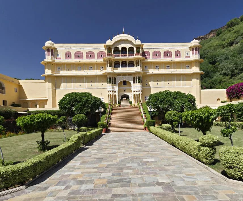 Samode Palace heritage facade rising against the Aravalli foothills near Jaipur at golden hour