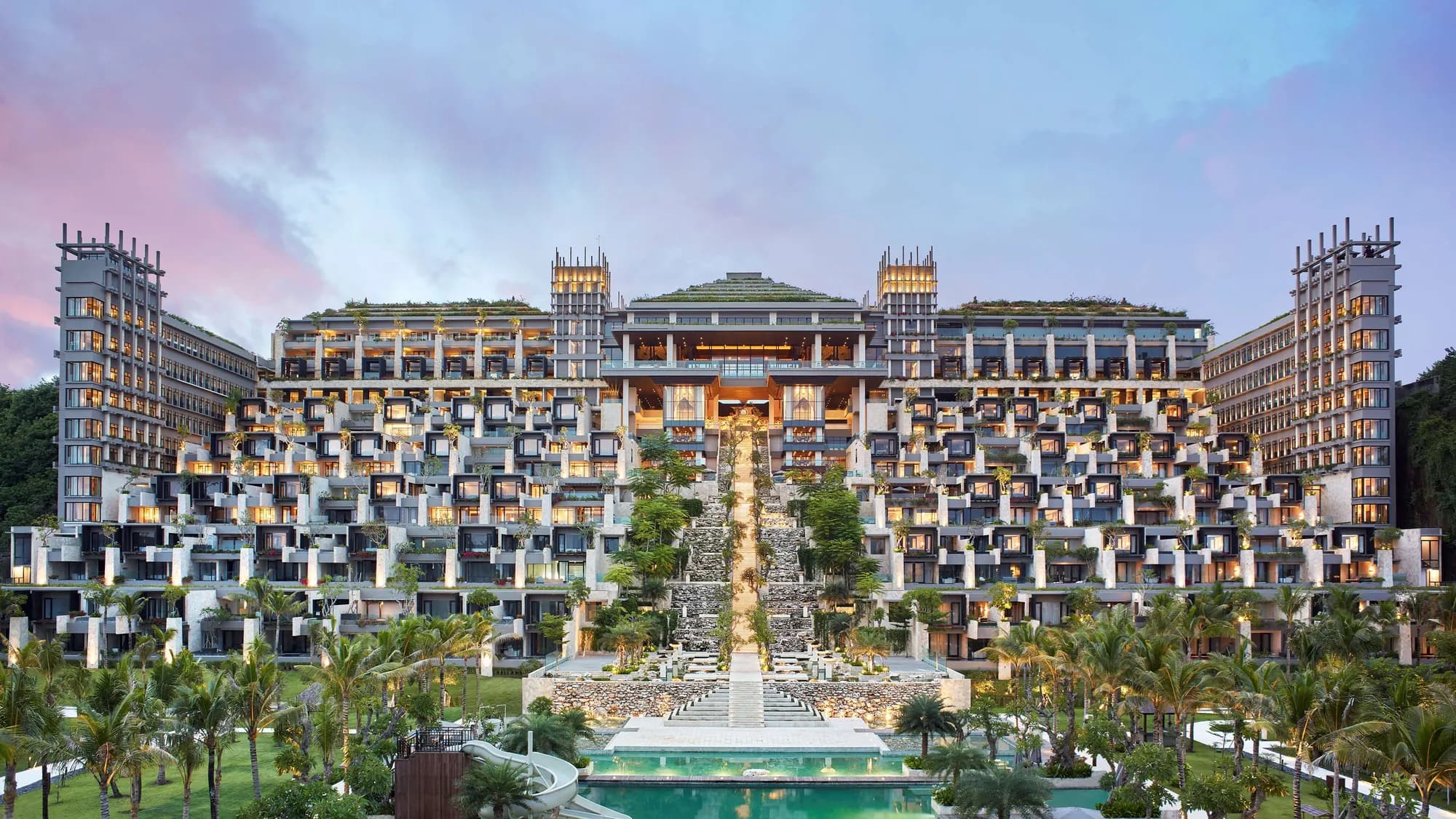 The Apurva Kempinski Bali tiered clifftop architecture cascading down to the Indian Ocean and private beach at Nusa Dua, Bali