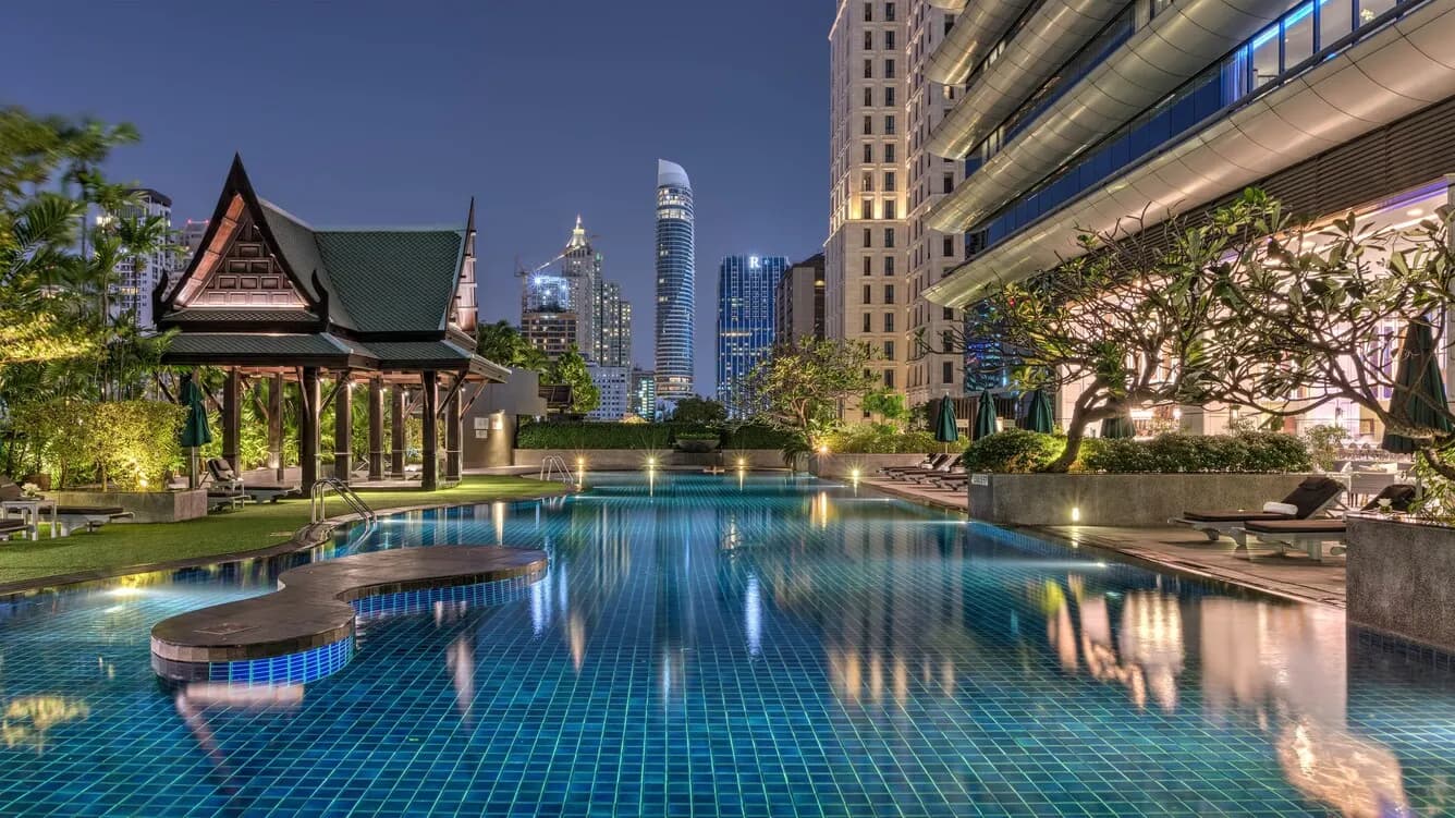 Rooftop sky garden and swimming-pool deck with city views at The Athenee Hotel Bangkok