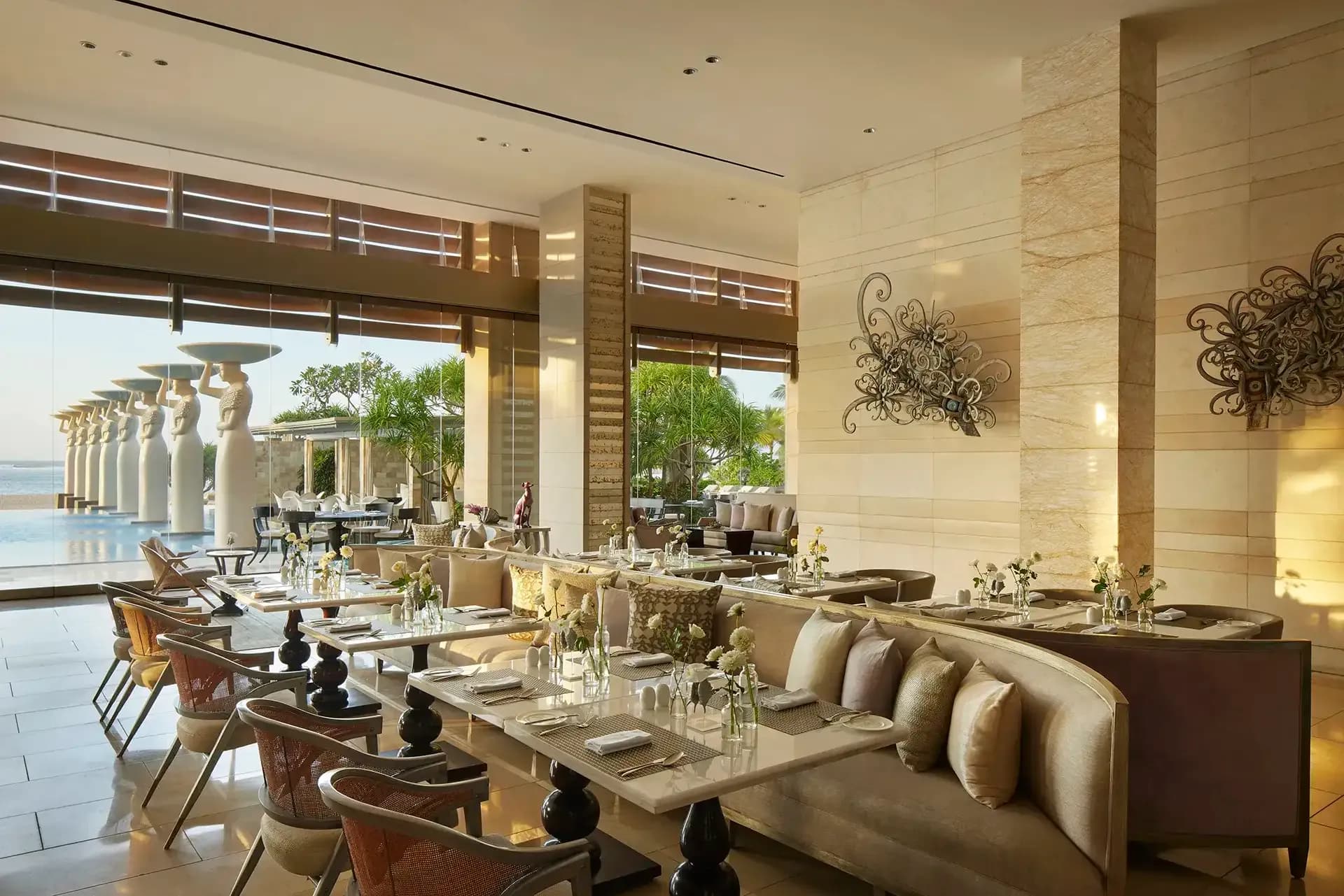 Grand arrival lounge with marble columns and chandeliers at The Mulia Bali, Nusa Dua