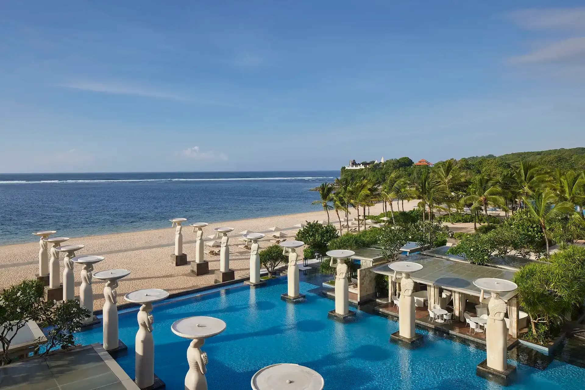 The Mulia Bali Oasis infinity pool and beachfront overlooking the Indian Ocean at Nusa Dua