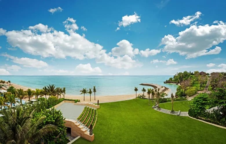 Unity Garden beachfront wedding lawn with the Indian Ocean and Geger Temple backdrop at The Mulia Bali