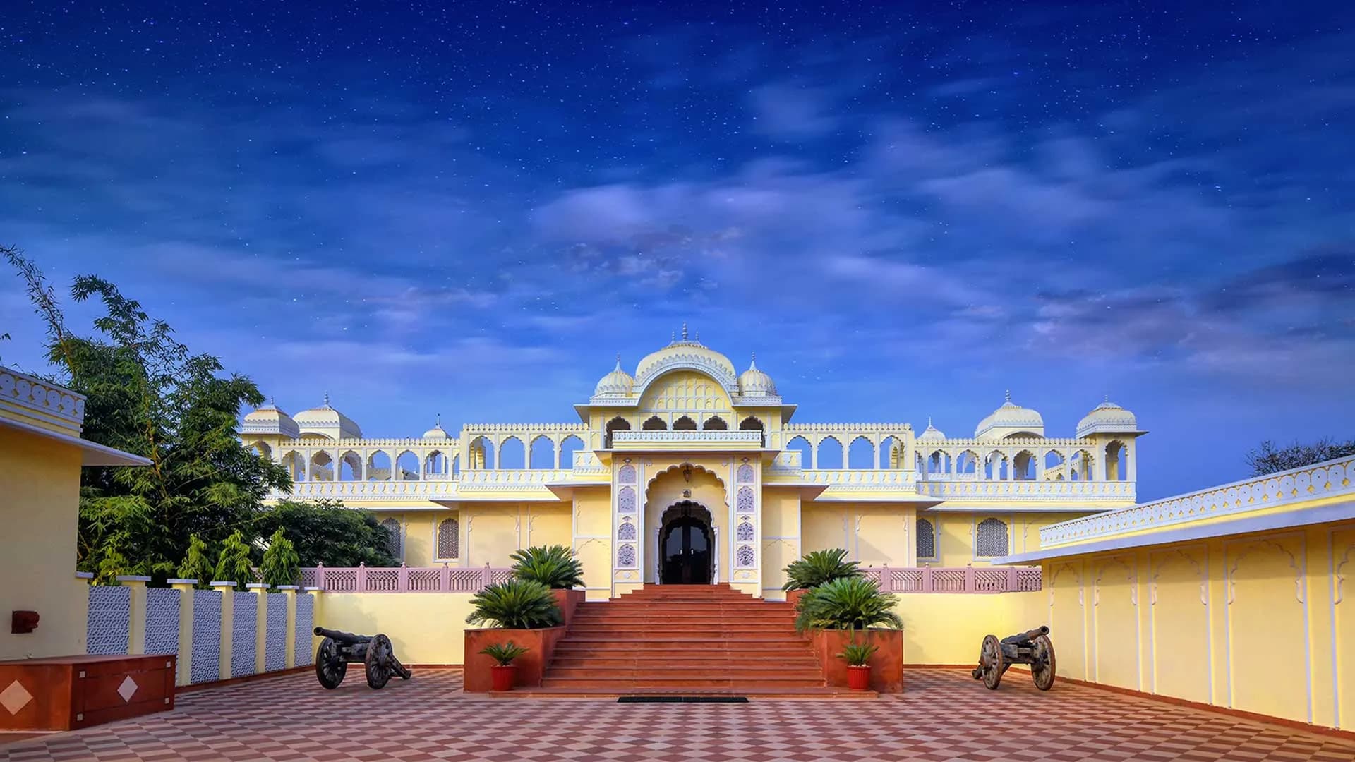 Heritage-style facade with arches of The Tigress Ranthambore resort on the edge of Ranthambore National Park